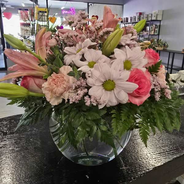 Pink and white mixed bouquet in a clear glass vase