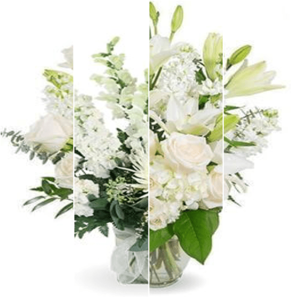 White floral arrangement in a glass vase with lilies and roses
