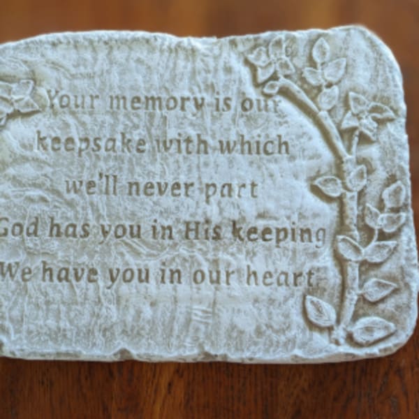 Memorial plaque with raised floral border and engraved sympathy verse