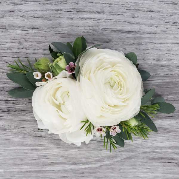 White ranunculus bouquet with small pink accent flowers