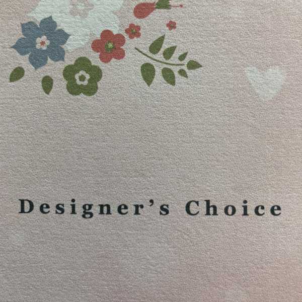 Designer’s Choice text with a small floral logo above it