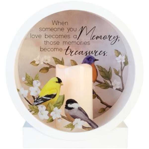 Memorial candle with birds and a quote in a white holder