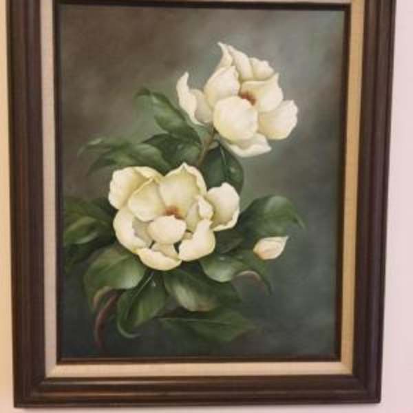 Framed painting of two white flowers with green leaves