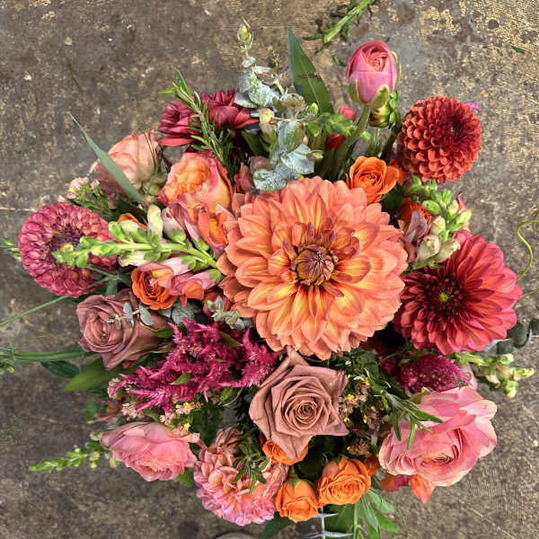 Colorful mixed bouquet with dahlias, roses, and pink blooms