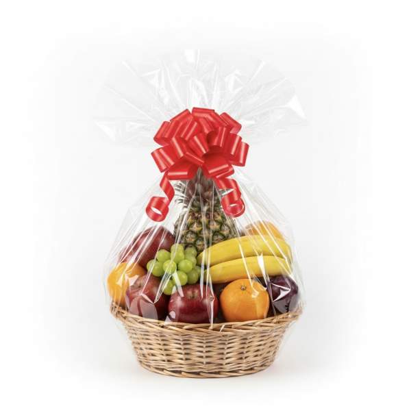 Wicker basket filled with assorted fresh fruit wrapped in cellophane and topped with a large red bow