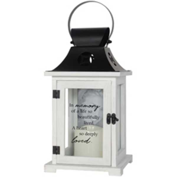 White memorial lantern with a candle inside