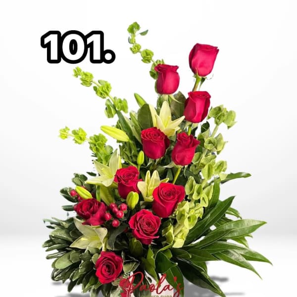 Bouquet of red roses and white lilies with greenery