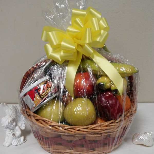 Fruit basket wrapped in cellophane with a yellow bow