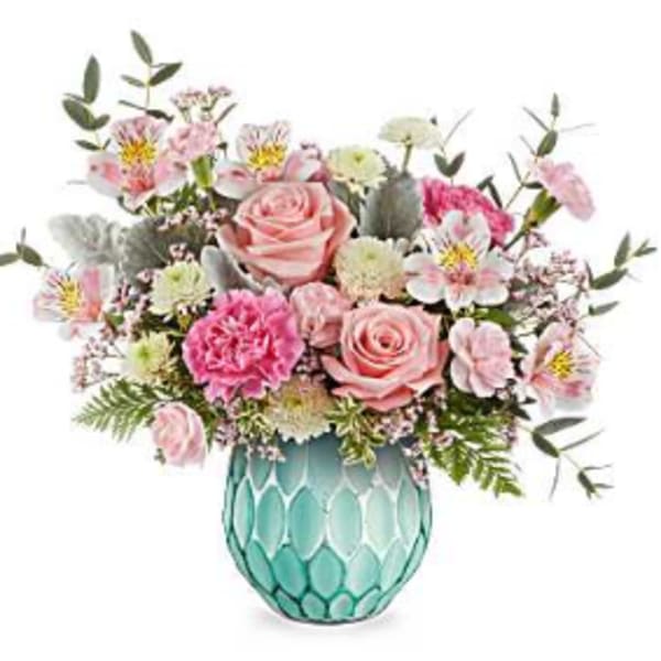 Pink and white mixed bouquet in a turquoise glass vase