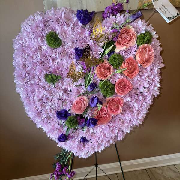 Heart-shaped floral standing spray with pink and purple flowers