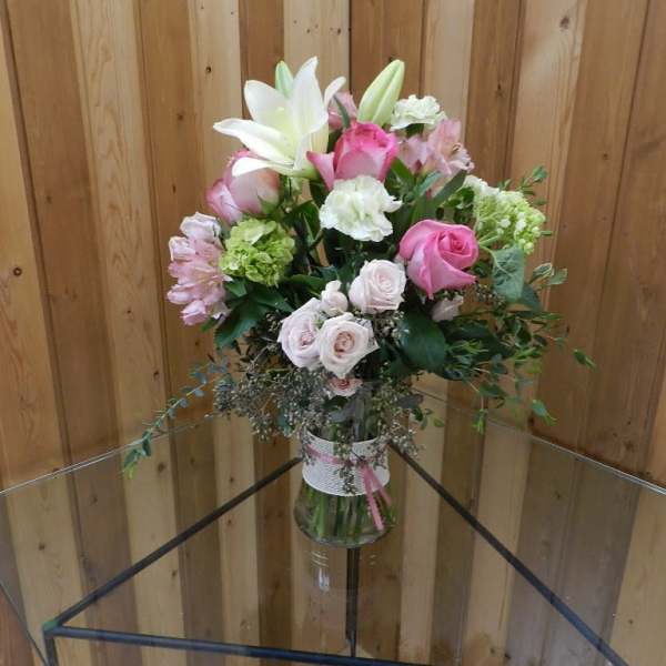 Pink and white mixed bouquet in a glass vase