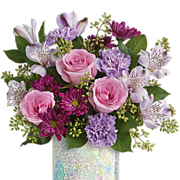 Pink and purple bouquet in a mosaic glass vase