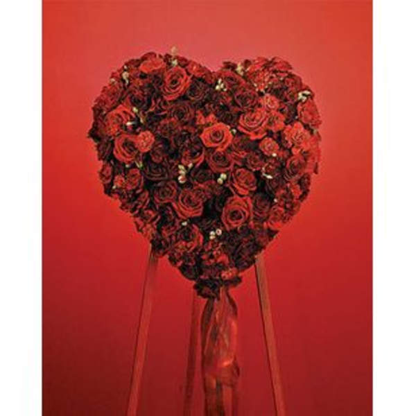 Heart-shaped bouquet of red roses with long ribbons