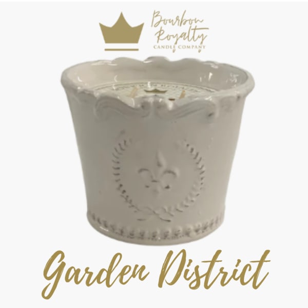 Cream ceramic candle jar with gold logo and text