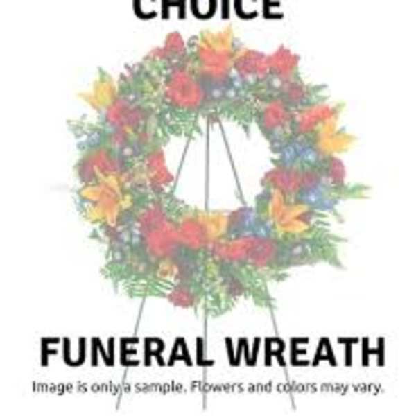 Colorful funeral wreath on a stand with mixed flowers