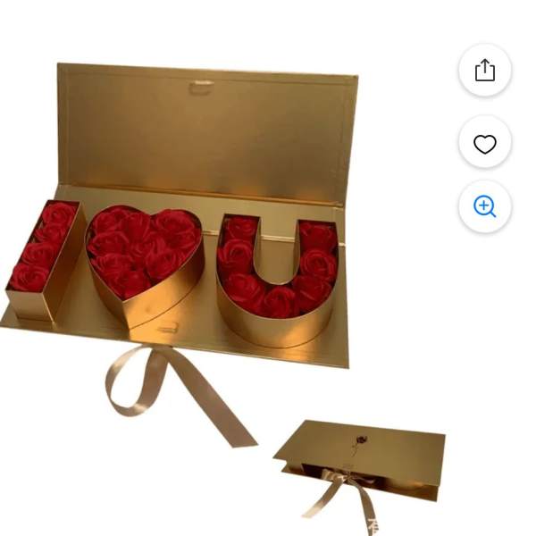 Gold gift box with red roses arranged to spell I love you