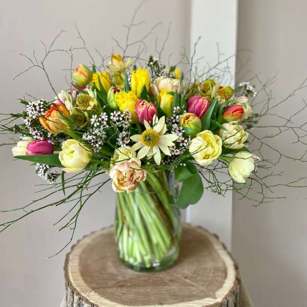 Mixed tulip bouquet in a clear glass vase