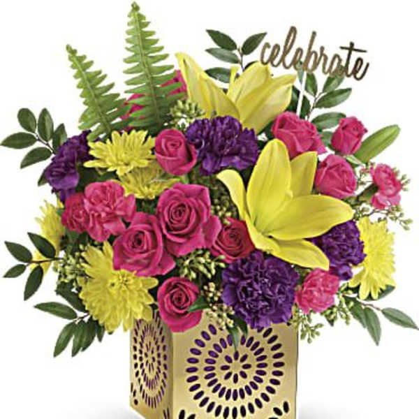 Bouquet of pink roses, yellow lilies, and purple flowers in a gold vase