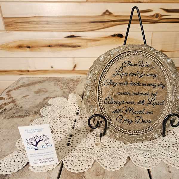 Decorative memorial plaque on a stand with a sympathy message
