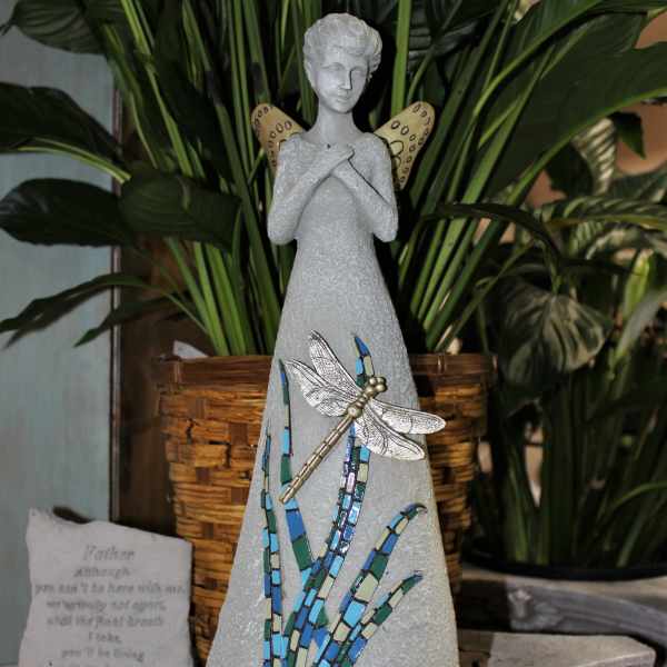 Decorative angel figurine with a dragonfly and mosaic accents