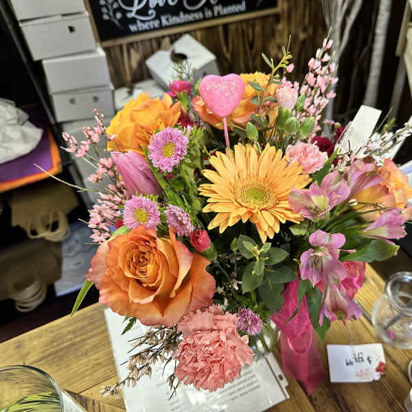 Colorful mixed bouquet with orange roses and yellow gerbera daisies