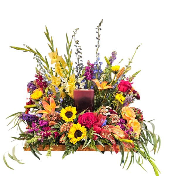 Colorful floral centerpiece with a candle in the middle