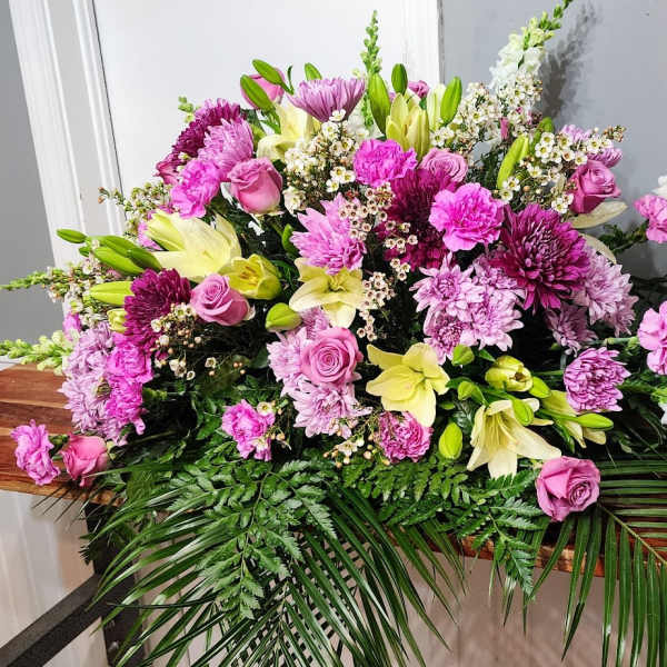 Large pink and white floral spray with lilies and roses