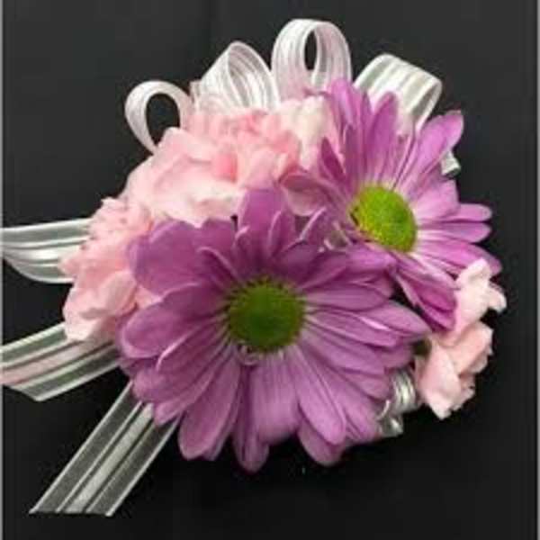 Pink and purple daisy corsage with silver ribbon