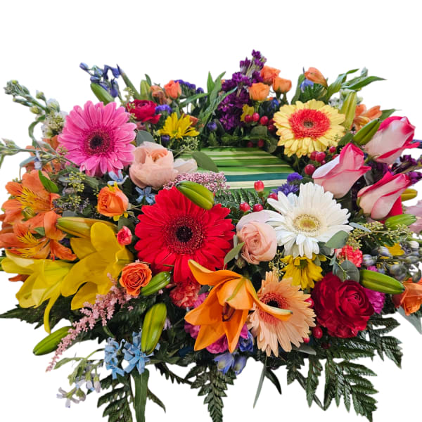 Colorful mixed flower arrangement with gerbera daisies, roses, lilies, and orchids