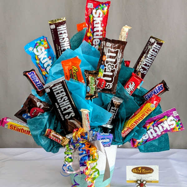 Candy bouquet with assorted chocolate bars in a decorated container