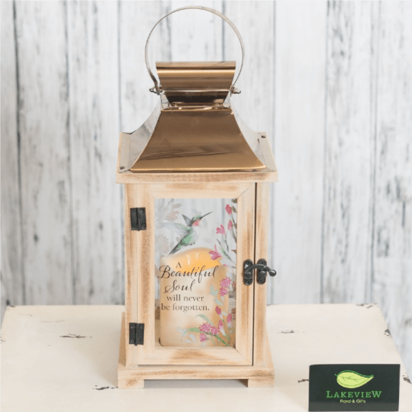 Wooden lantern with a memorial candle inside