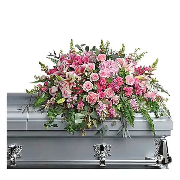 Pink floral casket spray on a silver casket