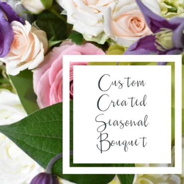 Bouquet of pink, white, and purple flowers with a text card