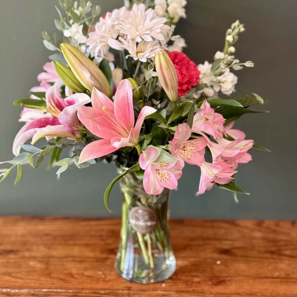 Pink and white mixed bouquet in a clear glass vase