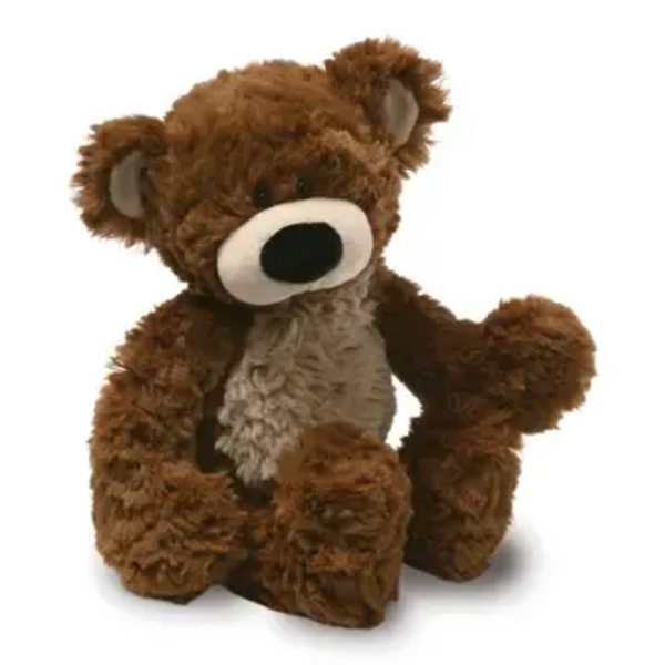 Brown plush teddy bear sitting on a white background