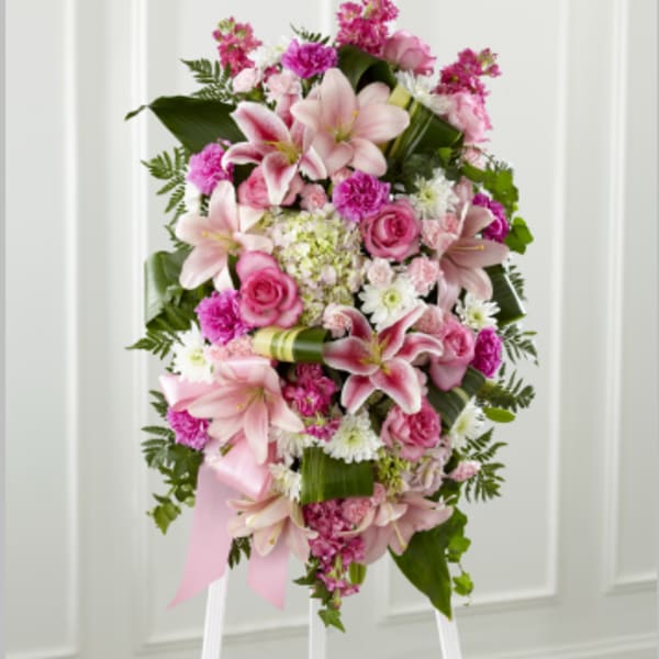 Pink and white floral standing spray with lilies and roses