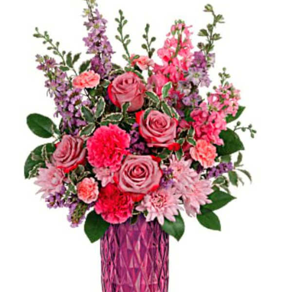 Pink and purple bouquet in a faceted pink vase