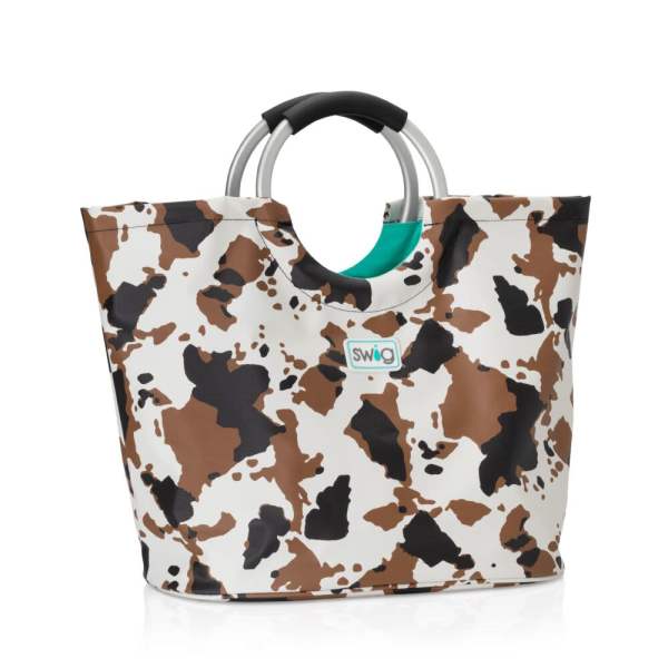 Cow-print tote bag with silver handles and a black grip
