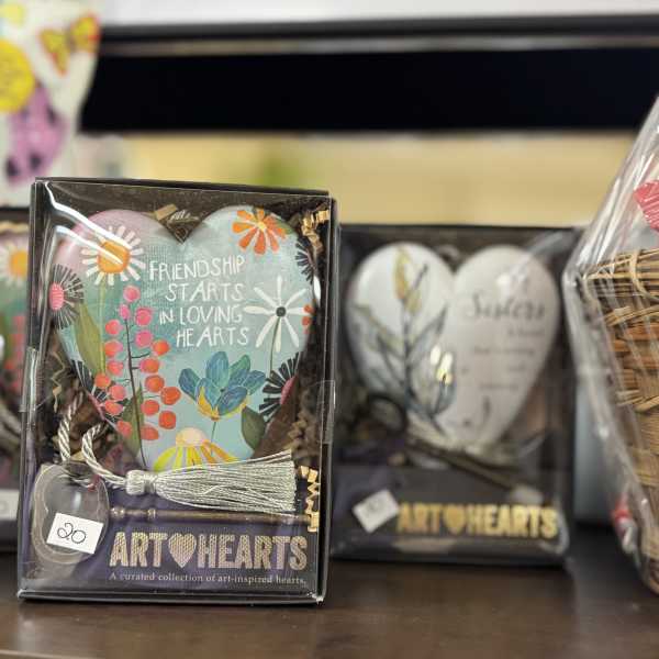 Gift box with a painted heart ornament and tassel