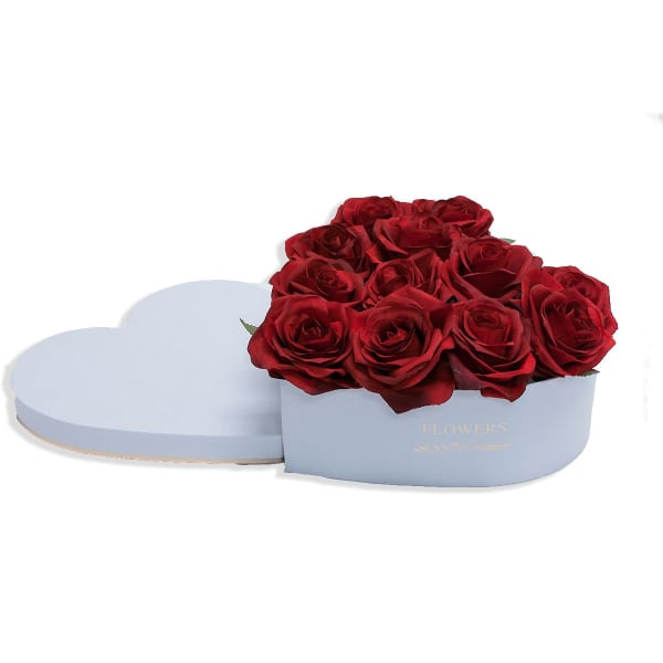 Red roses in a light blue heart-shaped box with a lid beside it