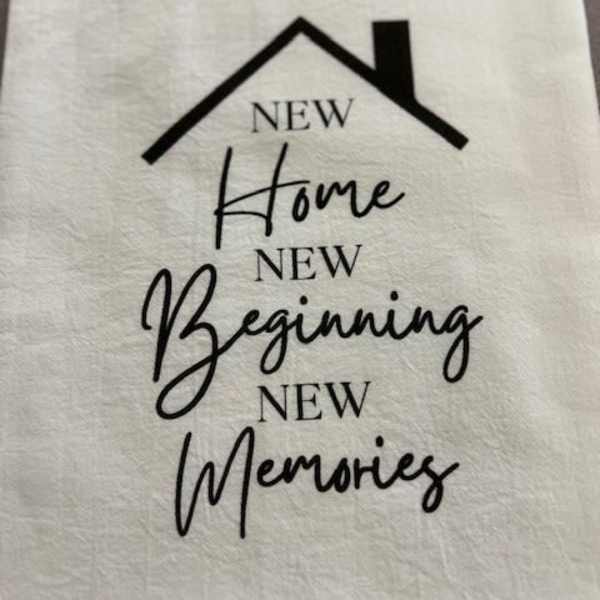 White fabric with a house graphic and the words New Home, New Beginning, New Memories