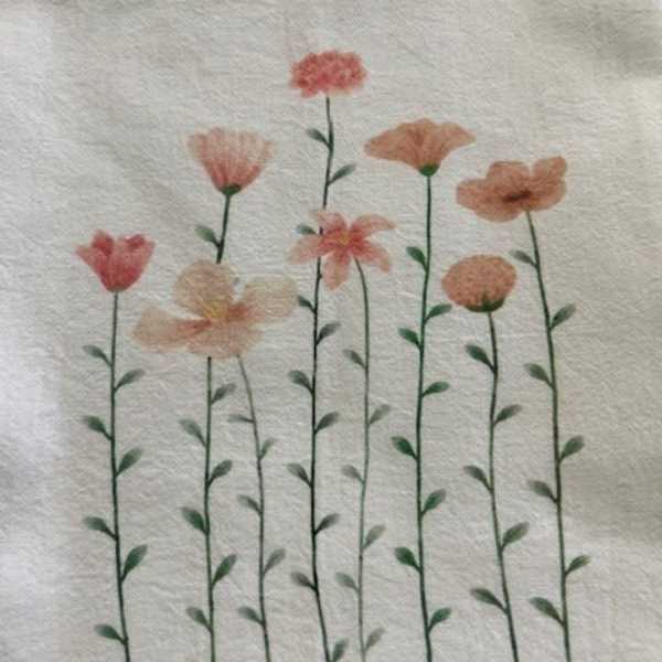 Floral print with tall pink and peach flowers on thin stems