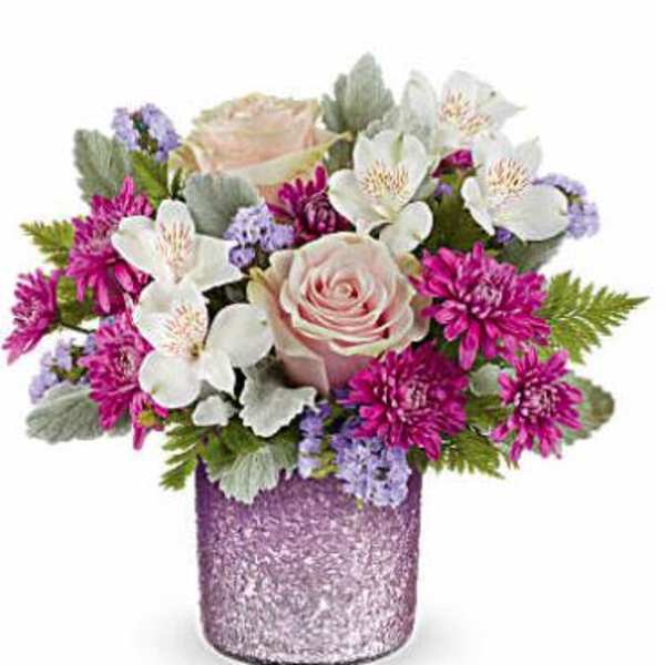 Pink rose bouquet with white flowers in a glittery purple vase