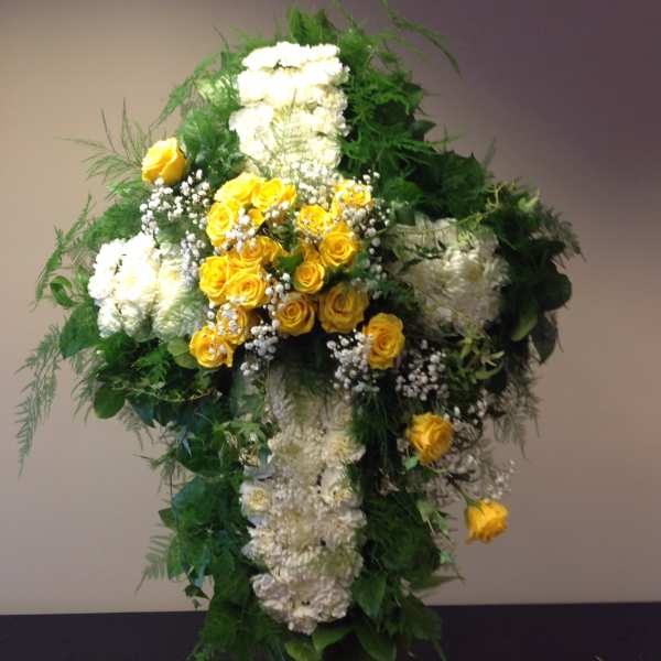 Tall standing floral spray with yellow and white flowers