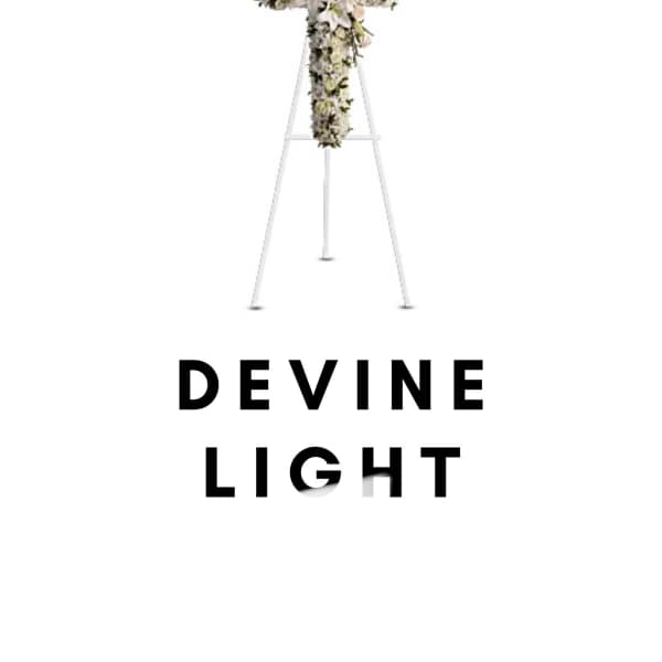 White floral cross on a stand