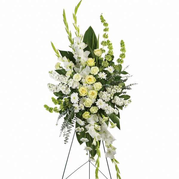 Tall white and pale yellow floral standing spray on an easel