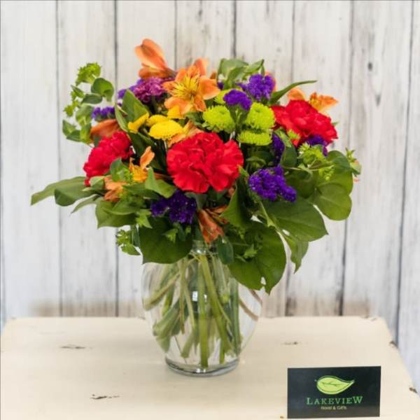 Colorful mixed bouquet in a clear glass vase