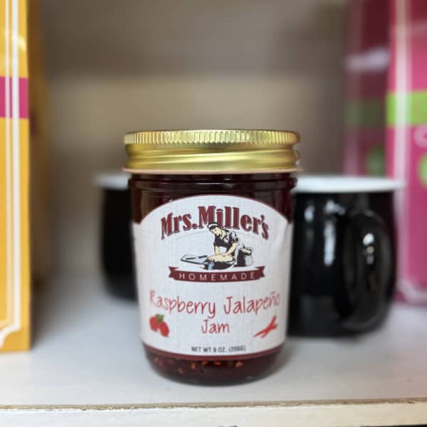 Jar of raspberry jalapeño jam with a gold lid
