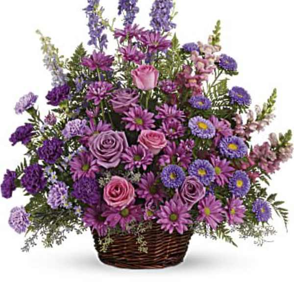 Basket arrangement of purple and pink flowers