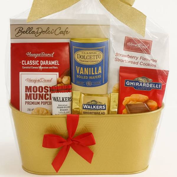 Gift basket with assorted packaged snacks and a gold bow